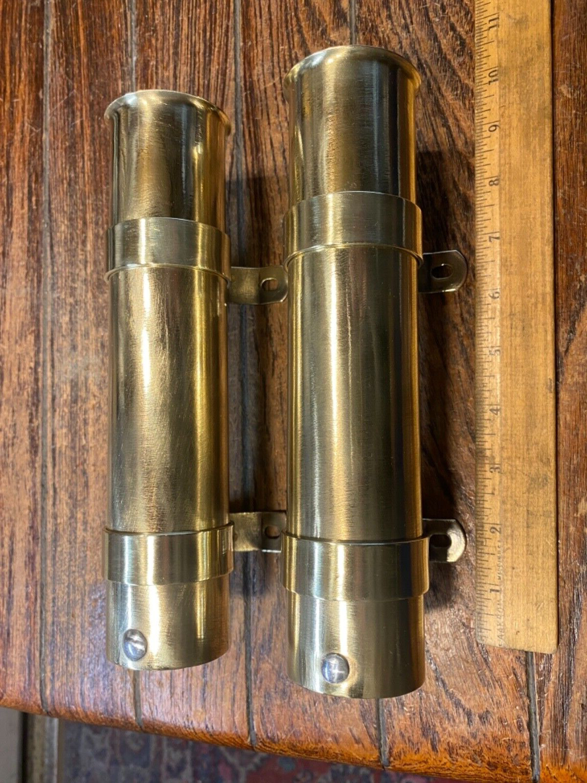 PAIR OF VINTAGE POLISHED BRASS ROD HOLDERS