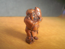 Hand Carved ojime bead Fisherman holding up big fish collectable boxwood figure picture